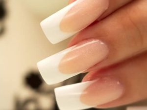 French manicure nails with a crisp reverse smile line