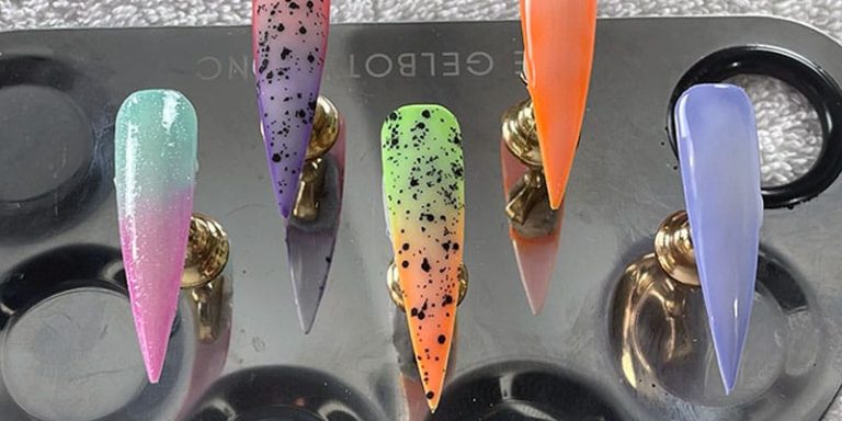 Pastel milky ombre nail designs on display tips