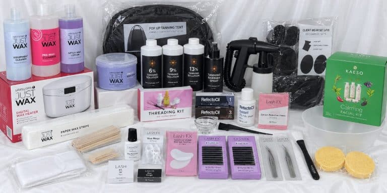 Complete Beauty Kit contents: Just Wax products and a heater, a tanning machine and solutions, lash trays, a threading kit and a facial kit