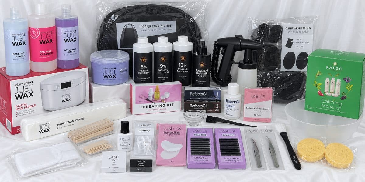 Complete Beauty Kit contents: Just Wax products and a heater, a tanning machine and solutions, lash trays, a threading kit and a facial kit