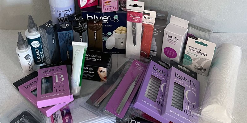 Complete Eye Kit contents laid out, with a Hive wax heater, Apraise tints and brow wax, Lash FX lash trays and tweezers