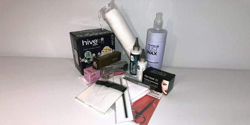 Eyebrow Definition Kit contents: a Hive wax heater, Apraise brow tint, micro applicators, scissors and tweezers