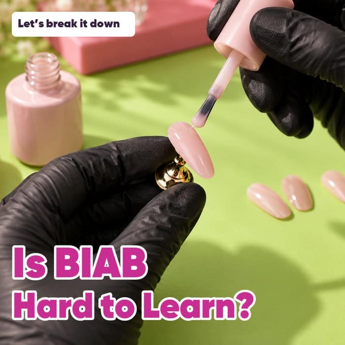Gloved hands practising with pale pink builder gel on an artificial nail, with “Is BIAB Hard to Learn?” and “Let’s break it down”.